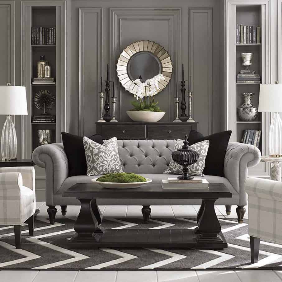 victorian house living room ideas with unique mirror and grey sofa also table lamps