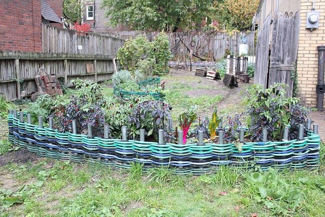 28. Garden Hoses Woven Into an Edging