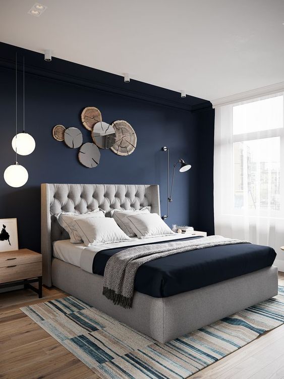 18. Navy Modern Bedroom With Wooden Wall Art