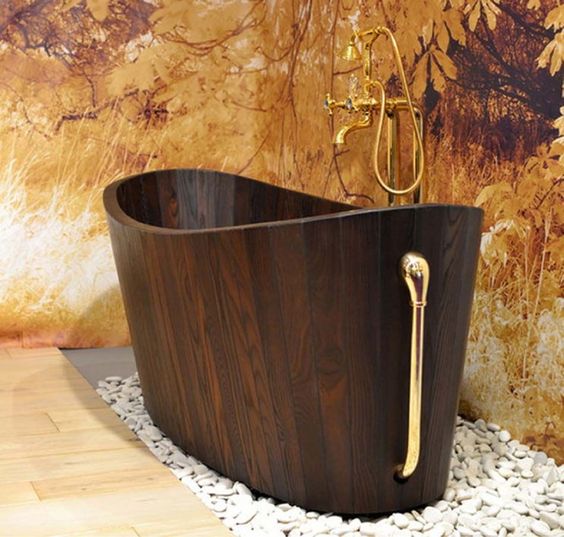 41. Golden Accents Enhance a Wooden Tub