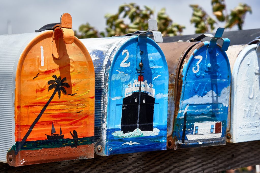 painting with acrylics on metal mailboxes