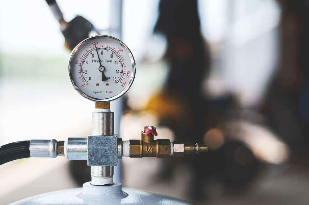 pressure meter of air compressor with soft-focus and over light in the background