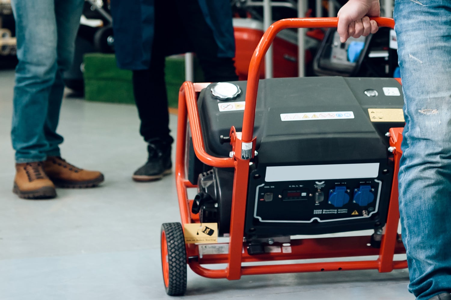 Salesman is showing couple of clients new generator.