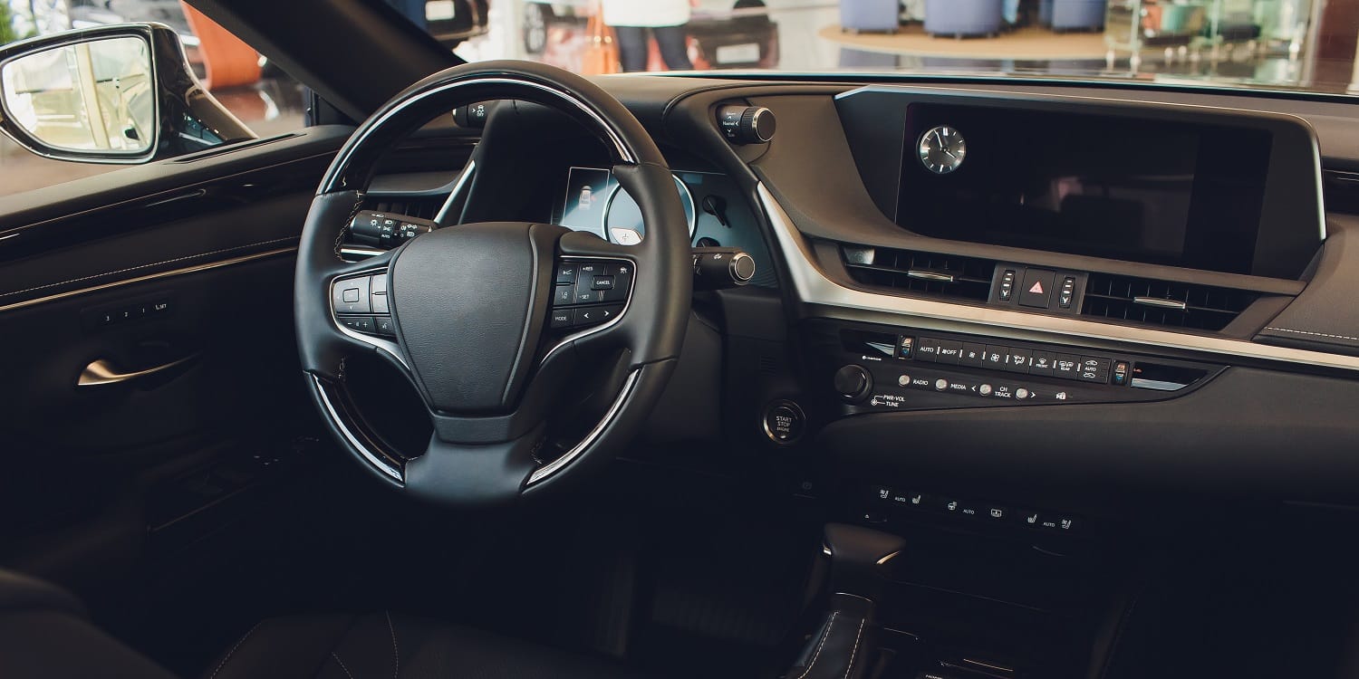 car interior. Modern car speedometer and illuminated dashboard. Luxurious car instrument cluster. Close up shot of car instrument panel