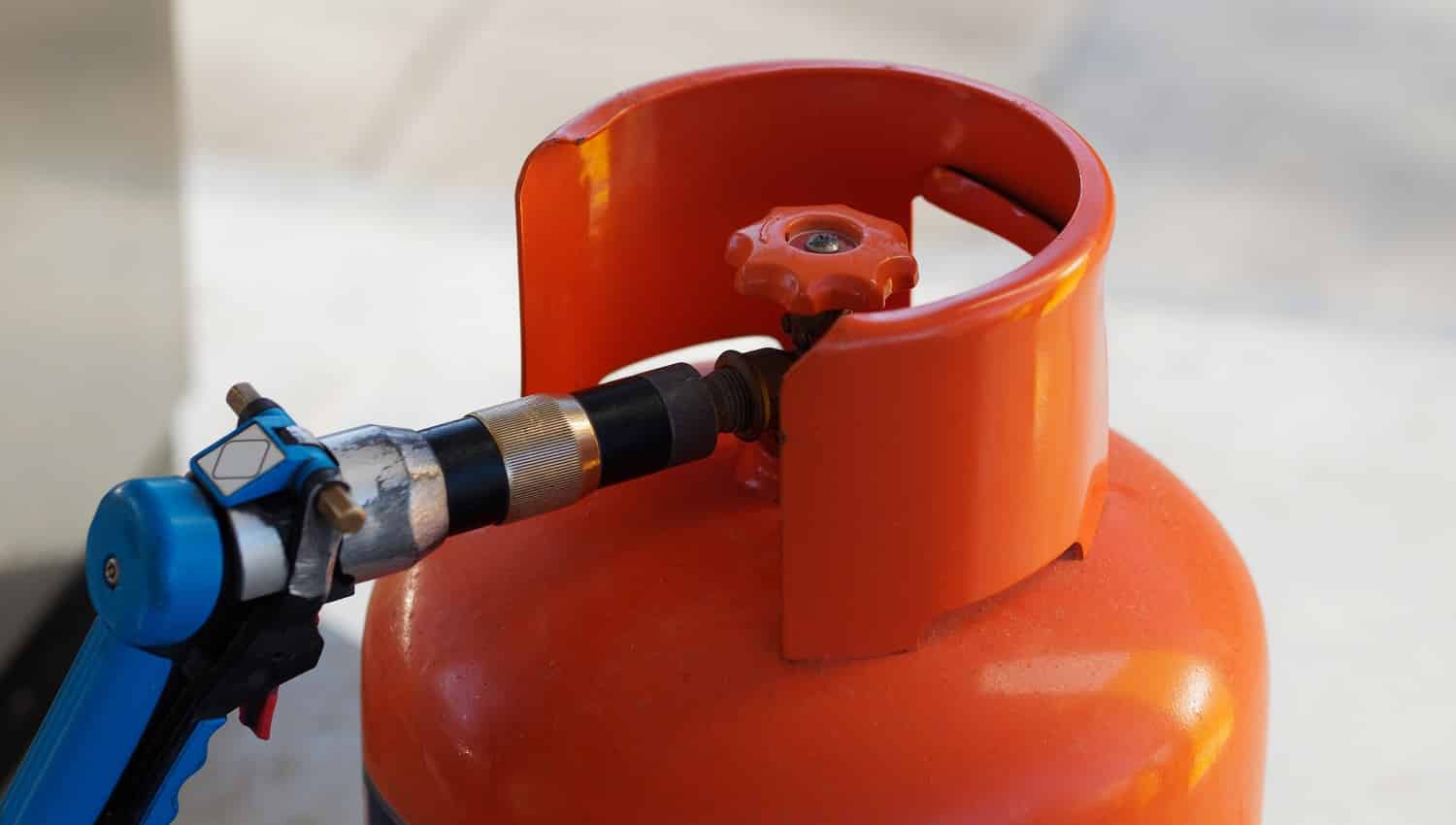 Close-up view. Refilling Gas Cylinder at a gas station. Dominican Republic.