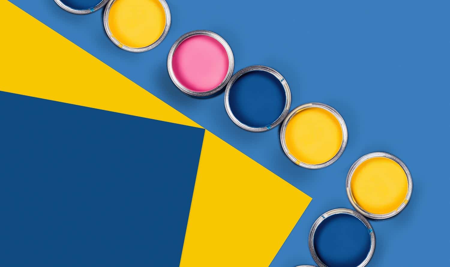 Renovation concept. Blue and yellow background with group of colored paint cans. Flat lay, top view, copy space.