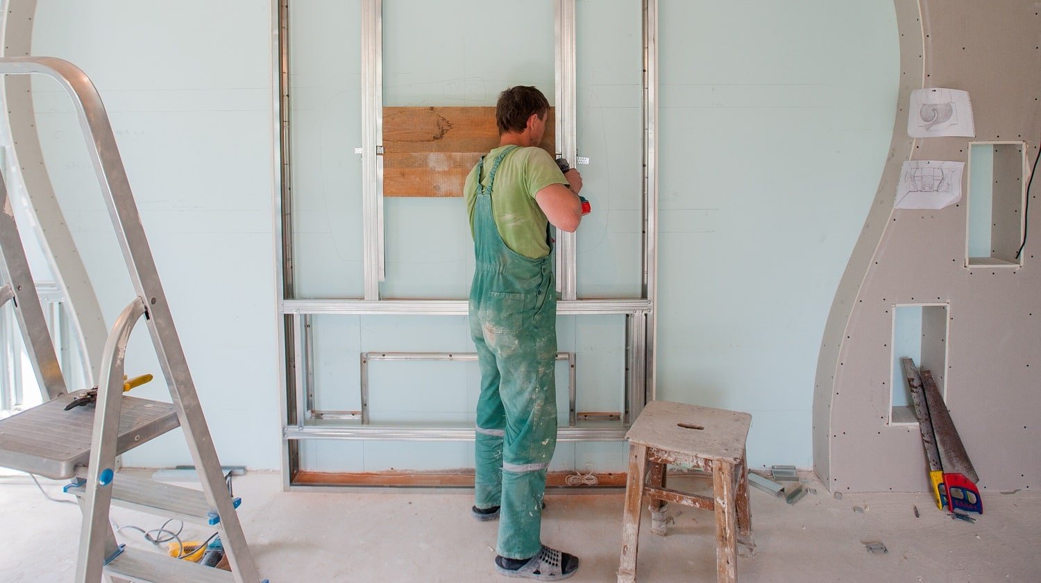 Construction worker wear safety uniform installation ceiling work.