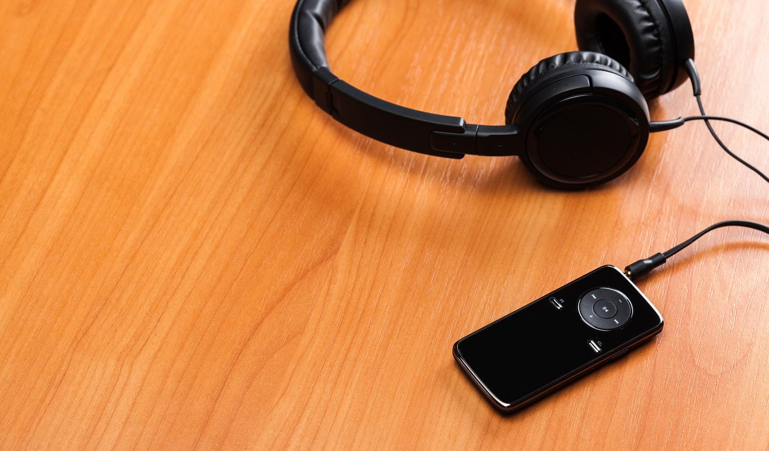 headphones on wooden background