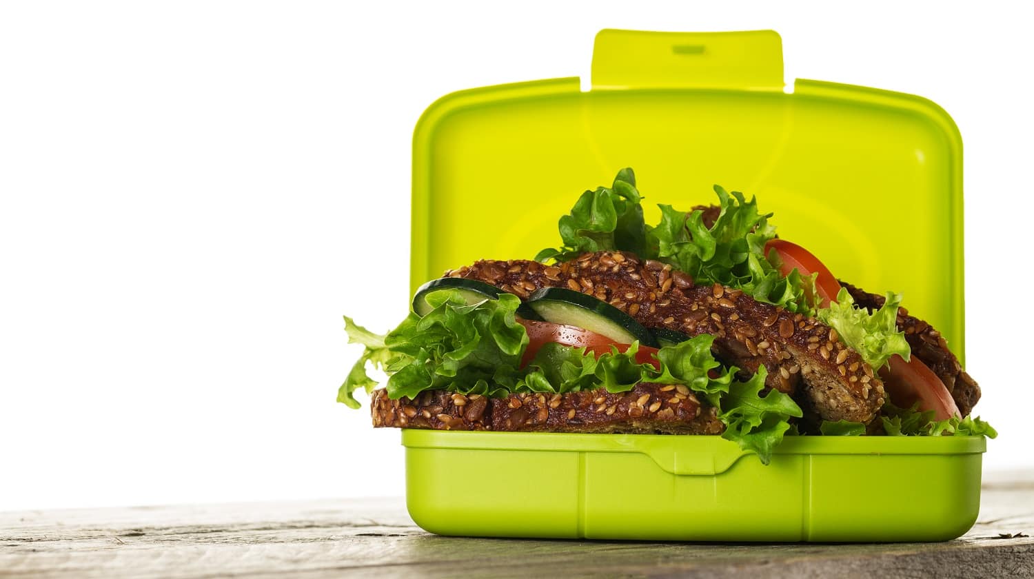 Tasty Healthy Vegetarian Vegan Sandwich in Lunch Box on Wooden Table on White Isolated Background. Horizontal. Copy Space.