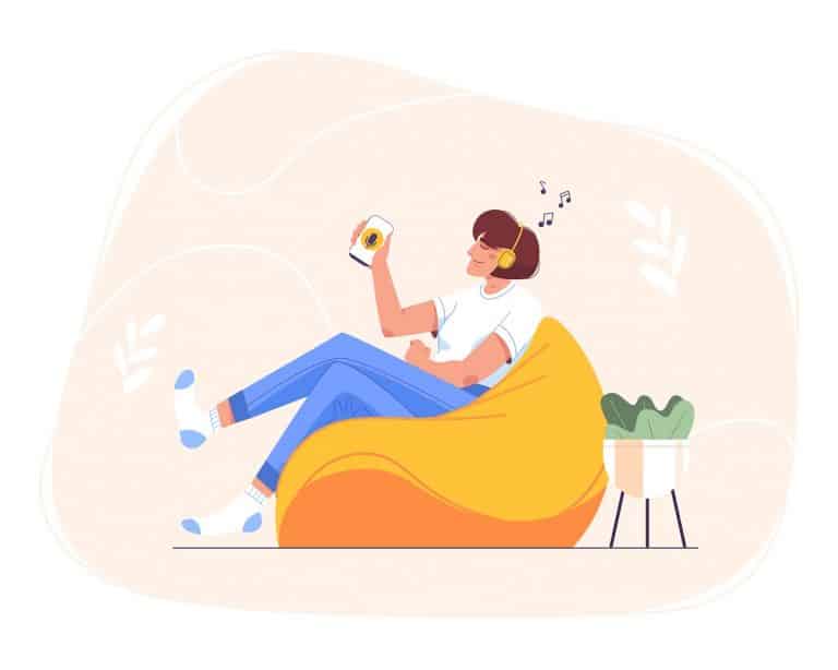 Flat happy teen girl in headphones sitting at home in bean bag chair and using smartphone for online education. Woman relaxing and listening to music, audio podcast, radio or audiobook on mobile phone