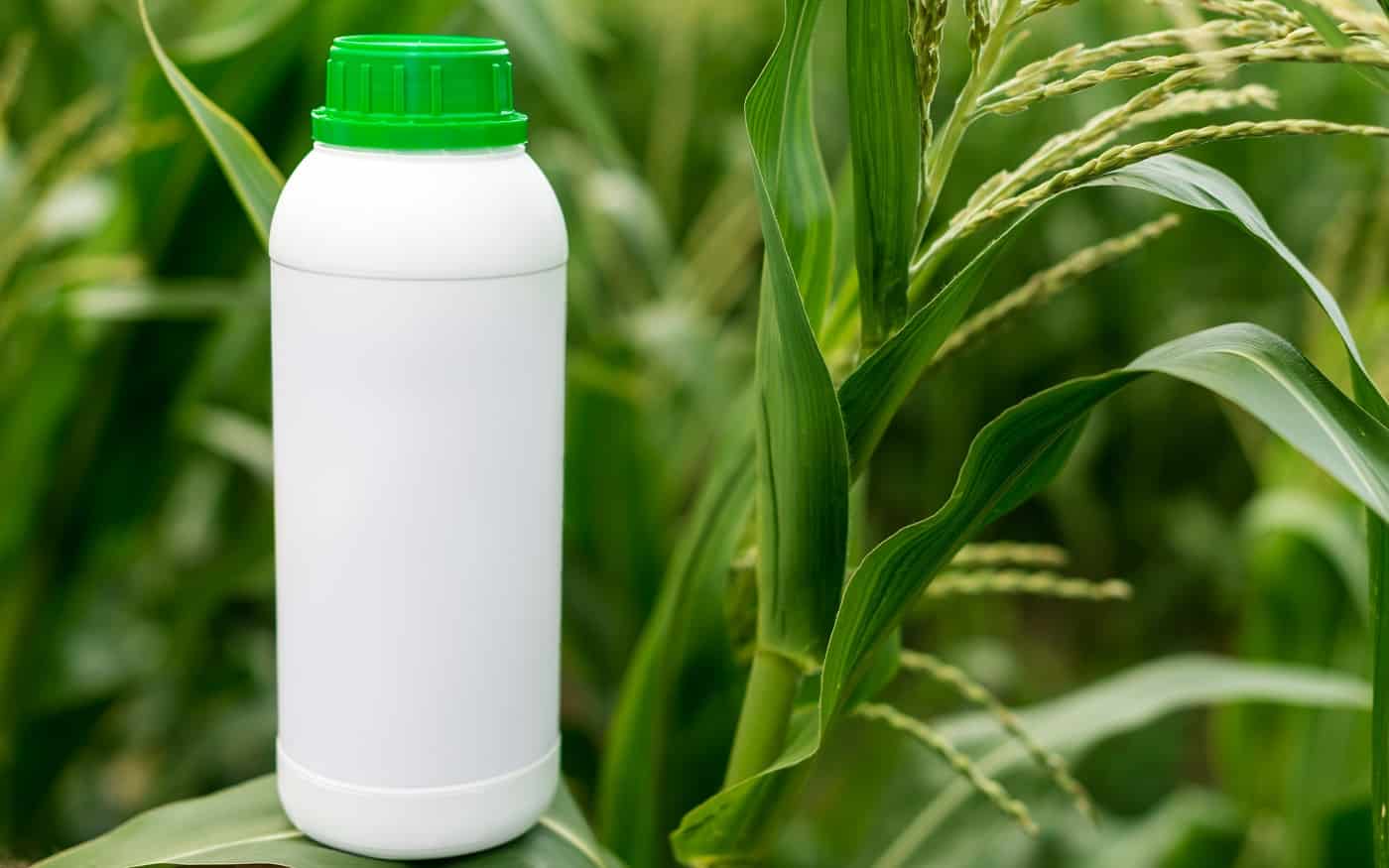 Closeup blank unlabelled bottle as mockup copy space for herbicide, fungicide or insecticide.- Image