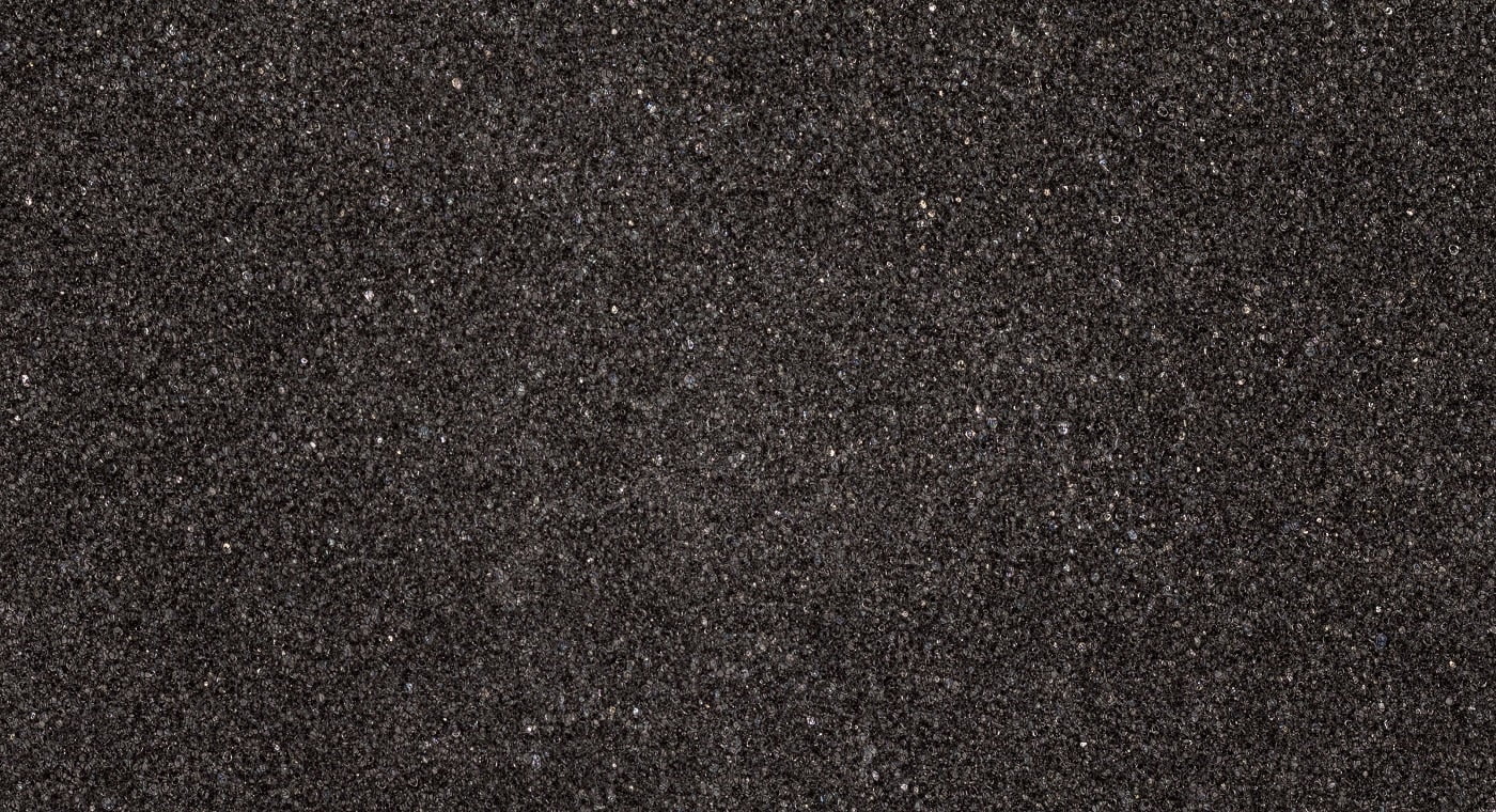 Black foam texture board. Soft rubber material background.