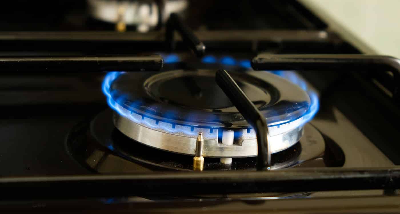 burning gas burner with blue flame.