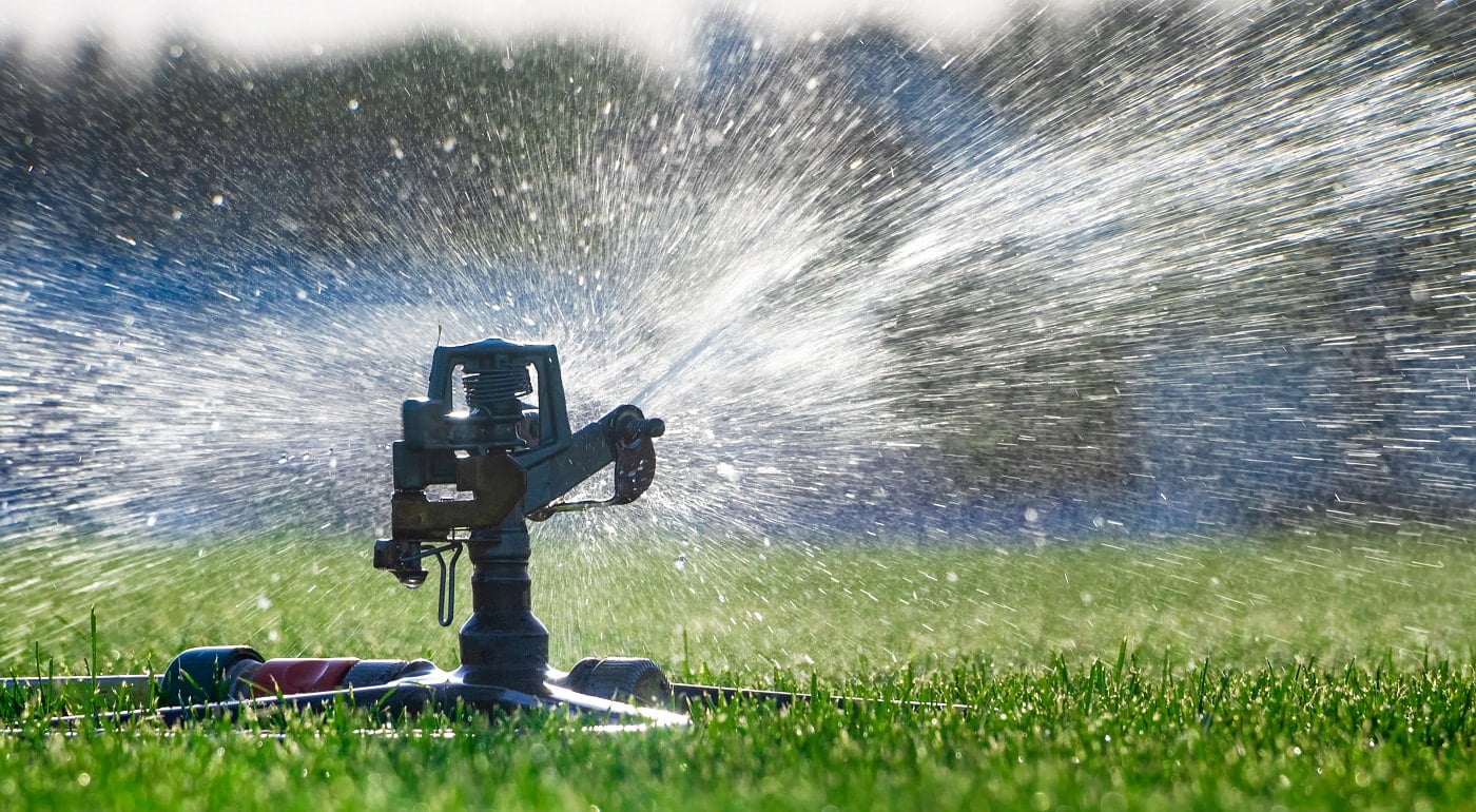 Automatic sprinkler system watering the lawn. close-up