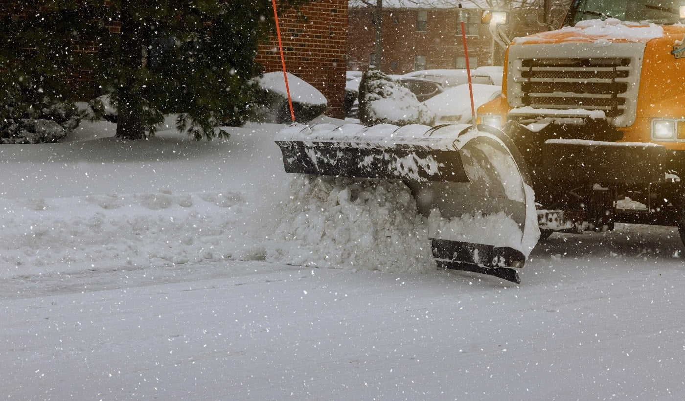 Tractor clears snow removal after snowfall blizzards clearing Gravel Driveways Snow Blower Buyer's Guide