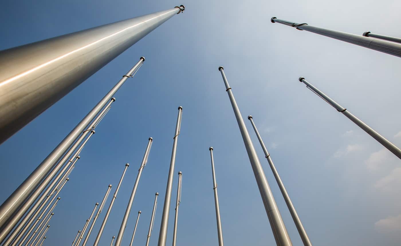 Row of flagpole in empty square,Tianjin,China.