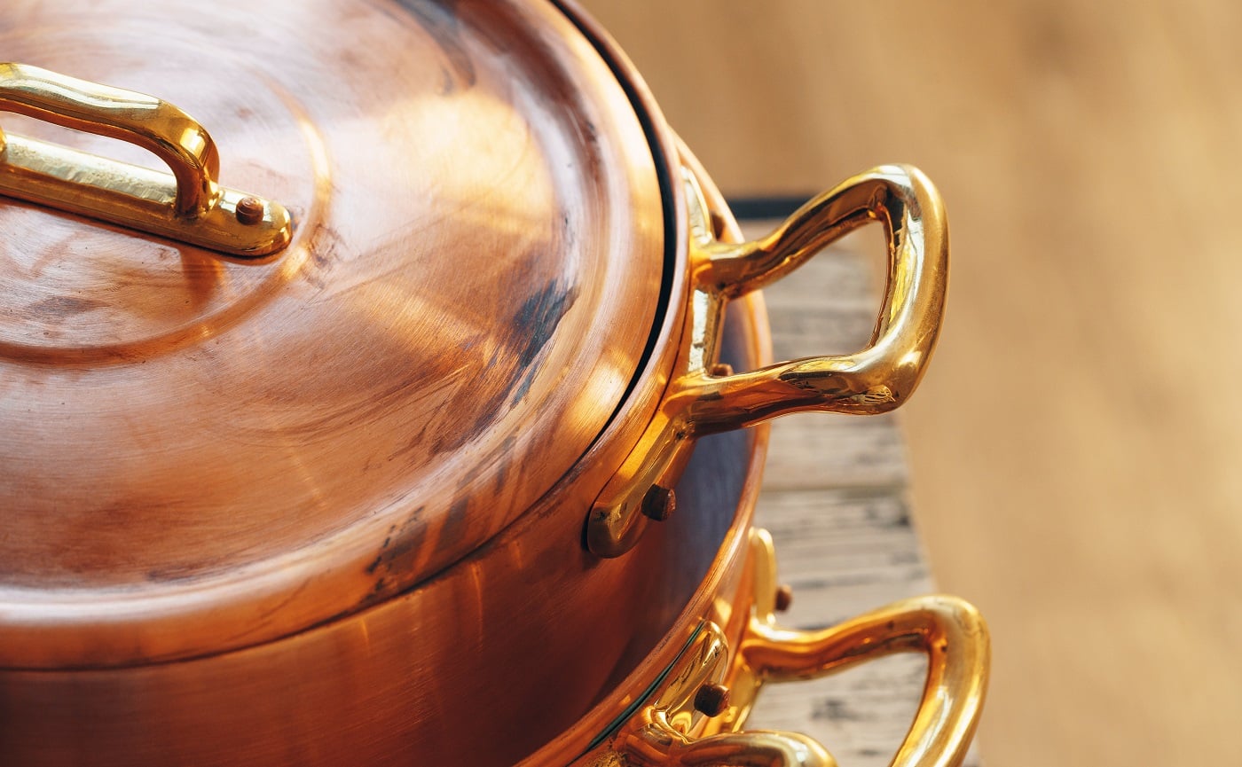 Close up of a set of copper cookware