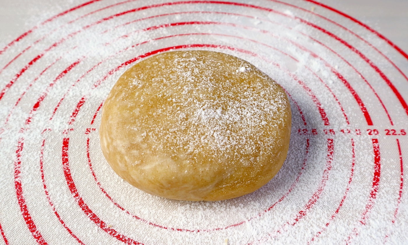 Pie dough isolated on a baking mat for the concept of baking at home