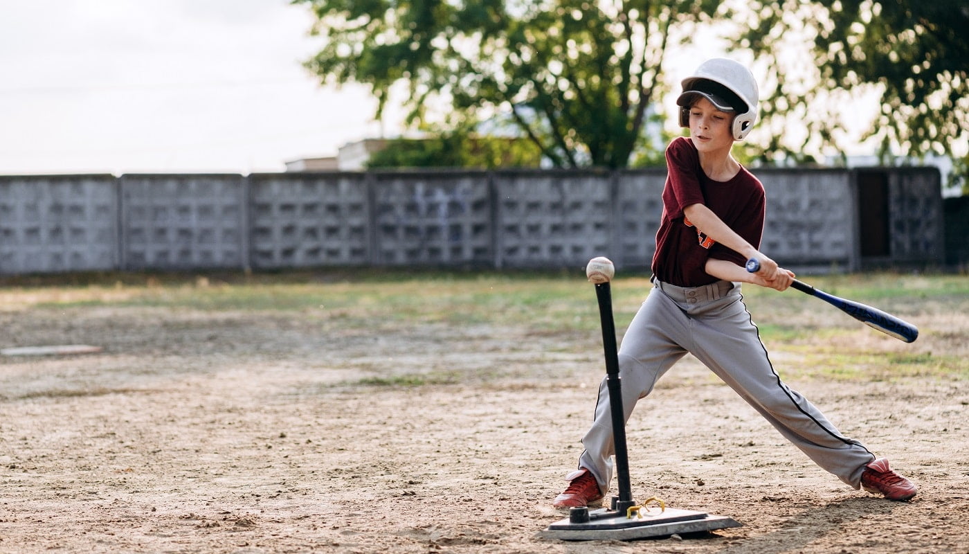 Kyiv, Ukraine - June 3, 2020: A boy, a baseball player, hits a ball with a Wiffle Ball Bats 