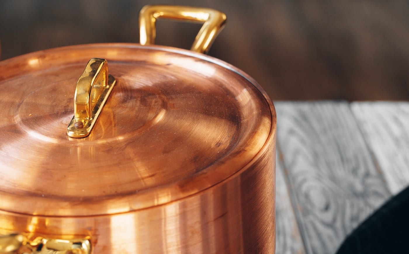 Close up of a set of copper cookware