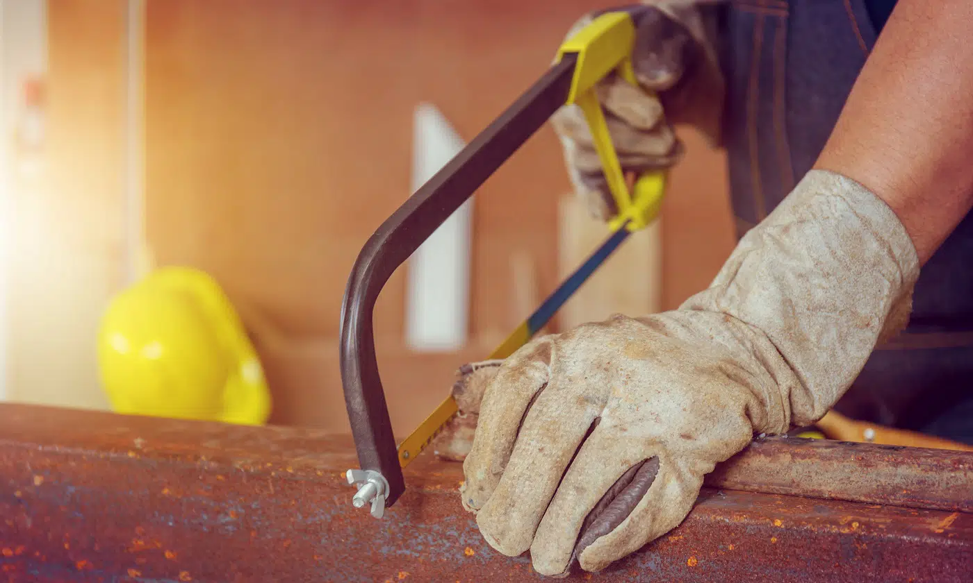 Close up of Craftsman worker sawing a steel pipe, Technician concept.