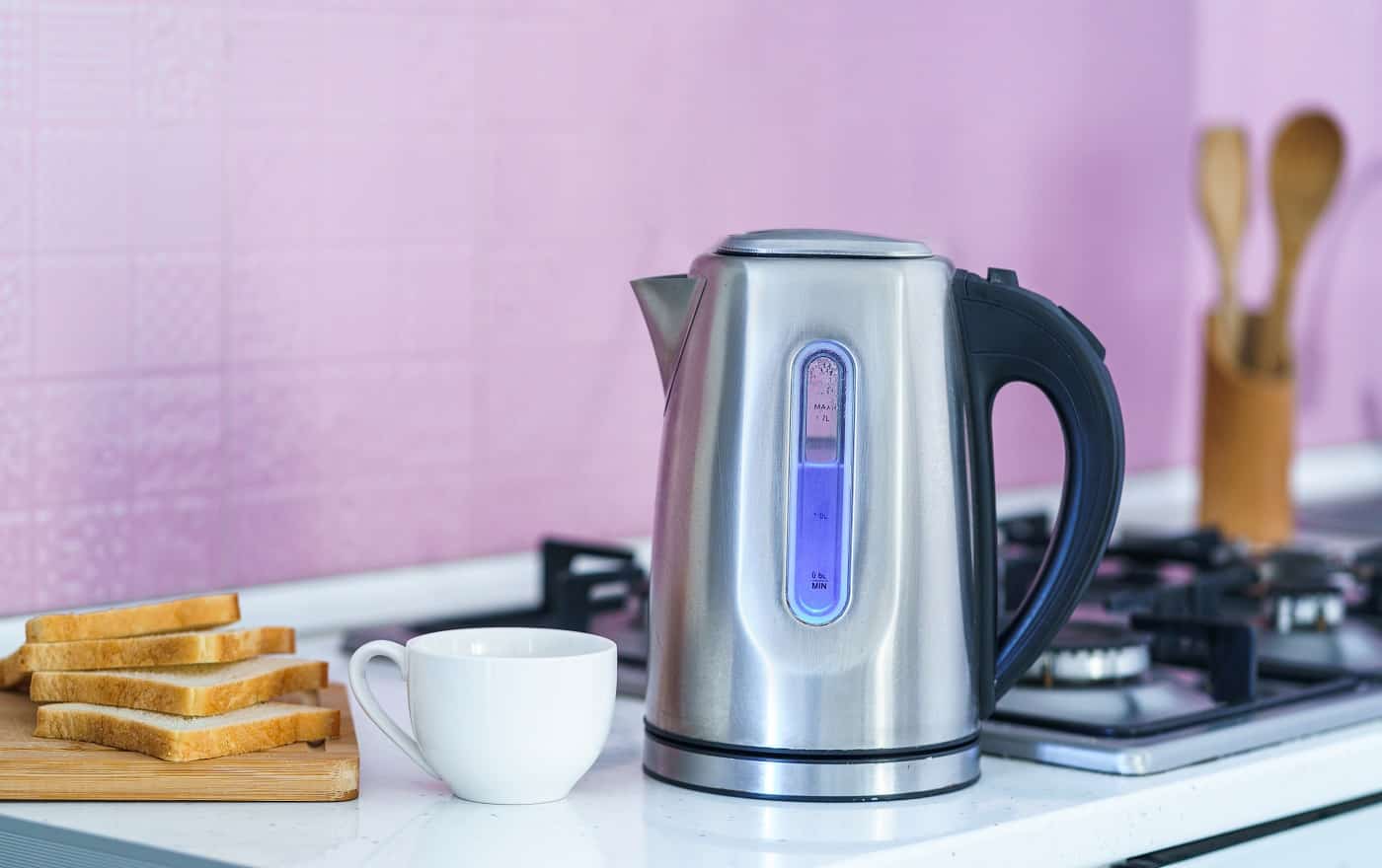 Using an electric kettle for brewing tea at home at kitchen. Electric Kettles Without Plastic .