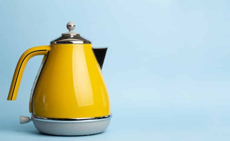 Kettle Background. Electric vintage retro kettle on a colored blue background. Lifestyle and design concept.