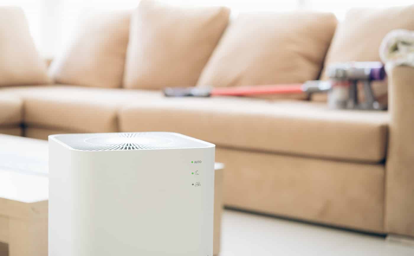 air purifier a living room, air cleaner removing fine dust in house. protect PM 2.5 dust and air pollution concept