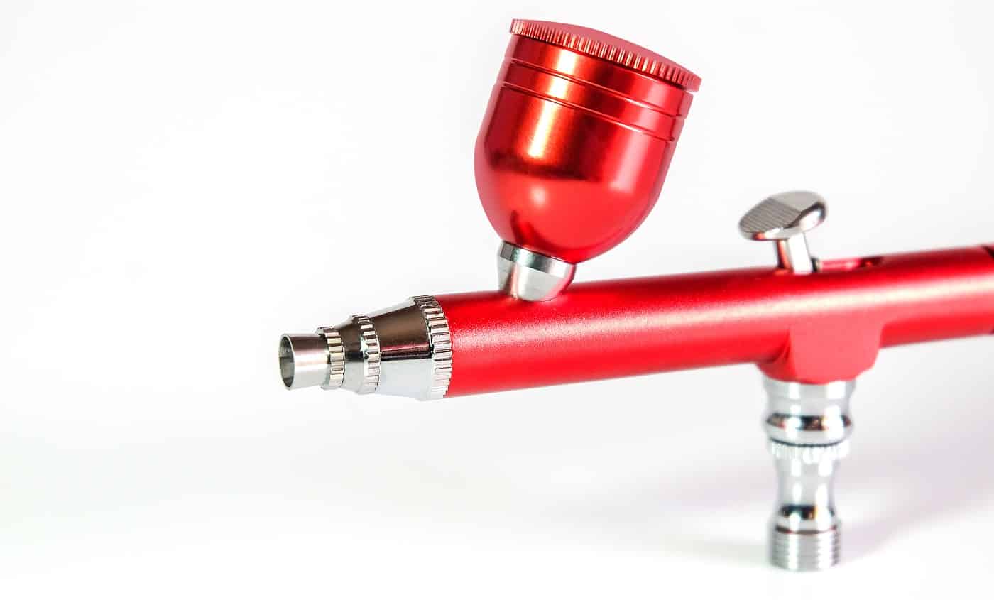 Red airbrush spray tool for paintingg hobby or work for art .