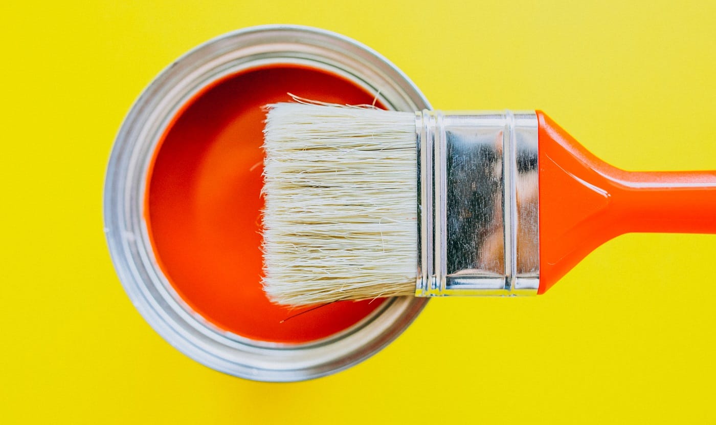 Paint can with paint brush for repairs isolated