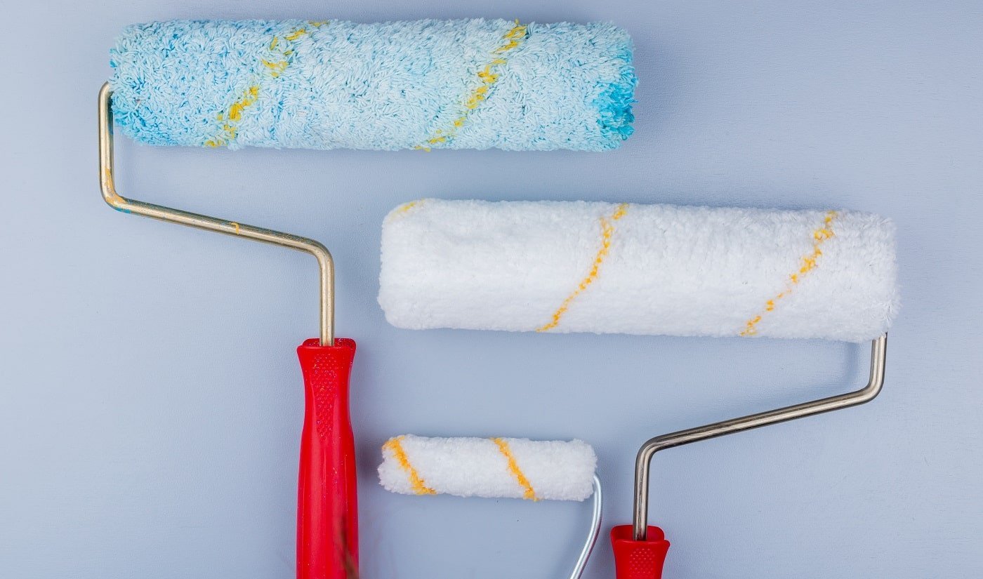 close-up view of paint rollers on gray background