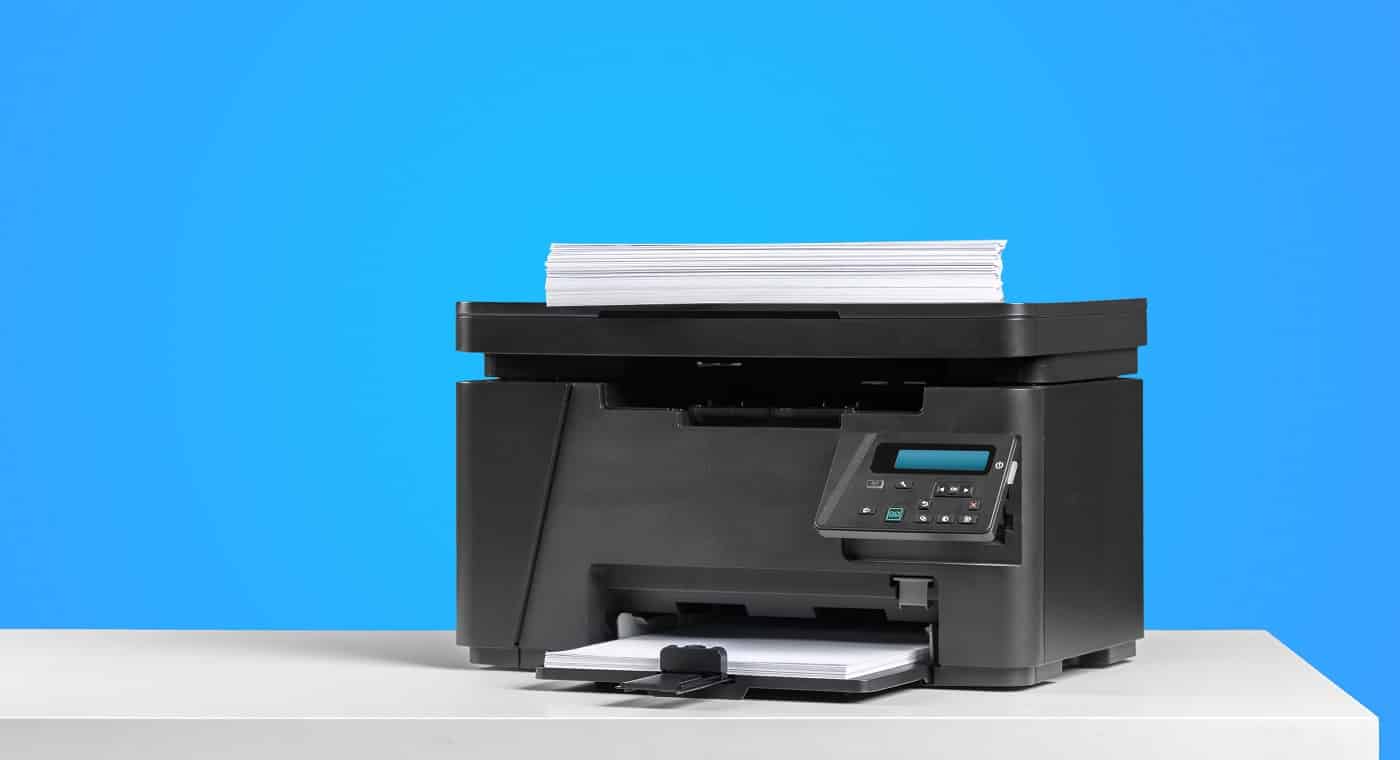 Printer copier machine on a bright colored background. Printer For Cardstock.