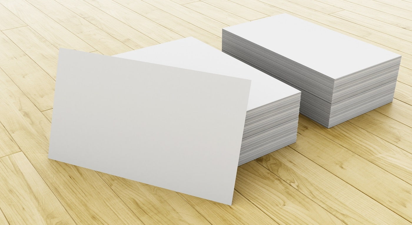 3d illustration. Stack of blank business cards on wooden table. Mock up for your design