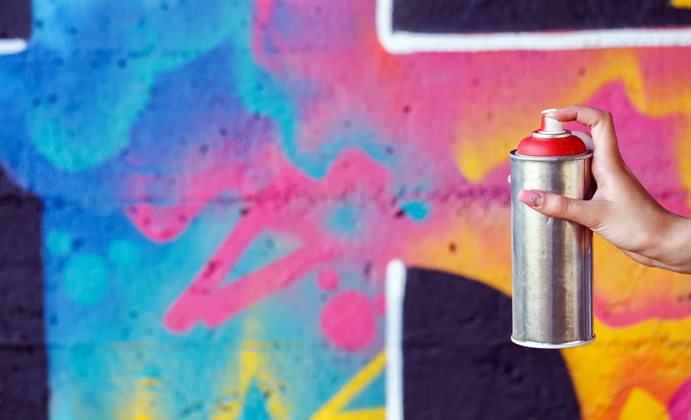 graffiti. Girl holding spray can