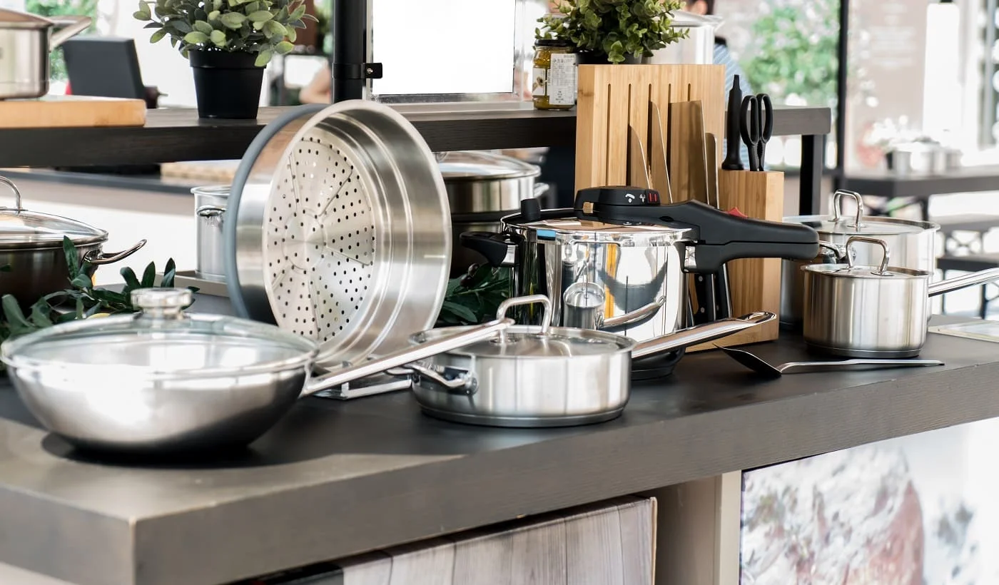 Stainless steel kitchenware on the table