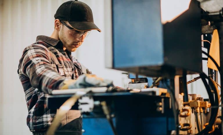 Man working on steel fatory and equipment for steel production