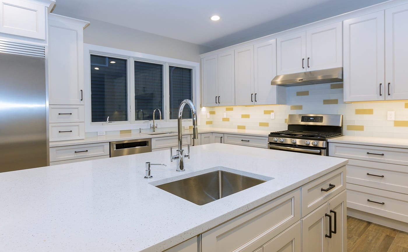 Assembling furniture kitchen with contemporary look of installation base cabinet countertops and sink. Best Ductless Range Hood.