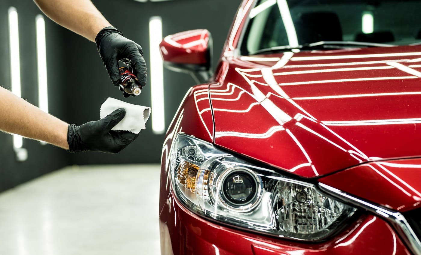 Car service worker applying nano coating on a car detail. Latex Paint Remover Verdict