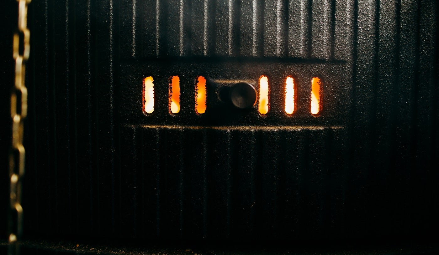 Bright flame inside of a black boiler