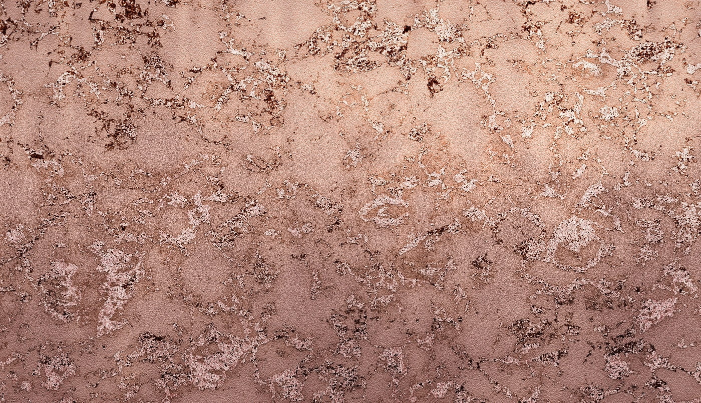 Rose gold paint on a rough background