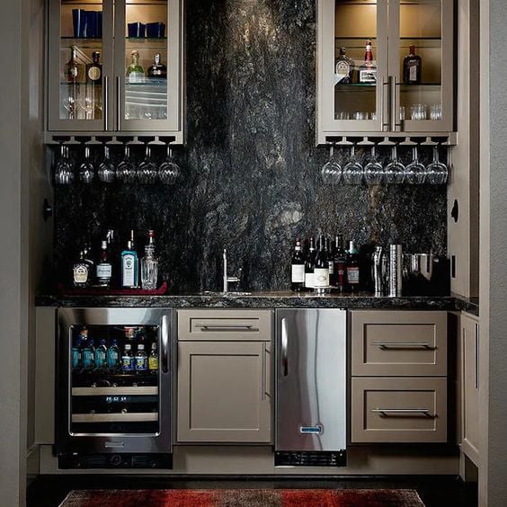 masculine basement bar with black rock backsplash