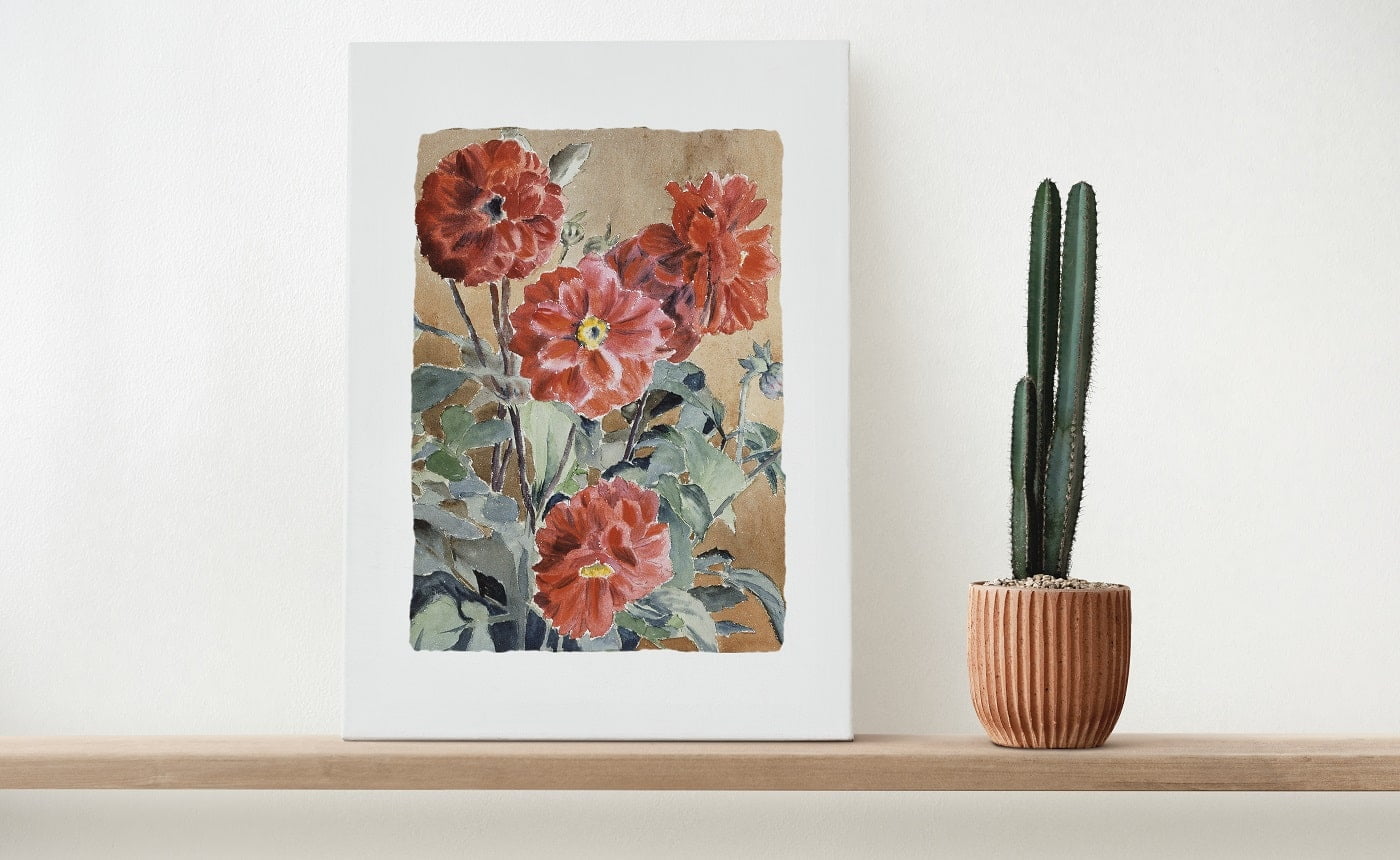 Canvas wall art on a wooden shelf with cactus