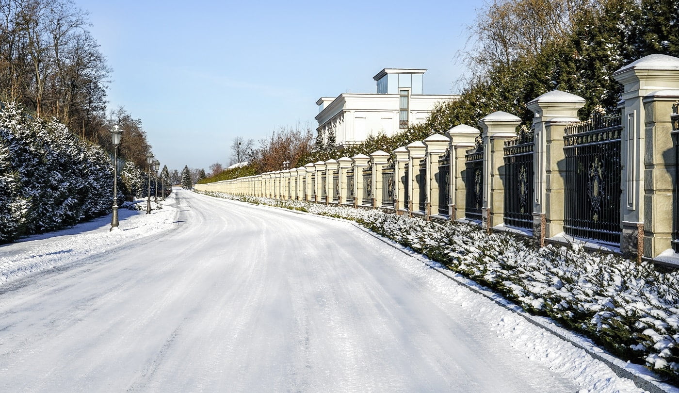 Road covered with snow on bright winter day