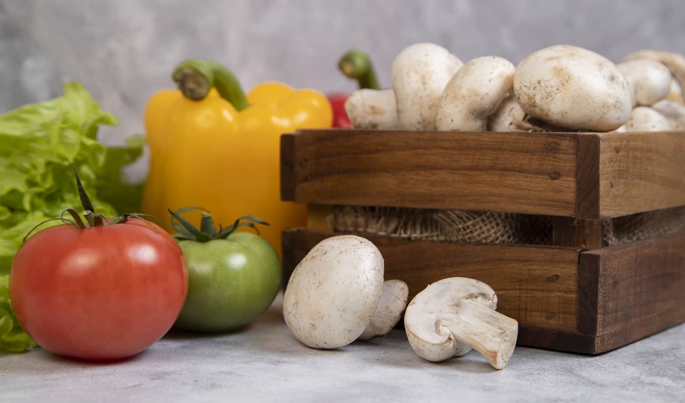 Various types of fresh healthy vegetables placed on a stone background . High quality photo