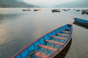 Wooden boats on the lake. Nepal evening.