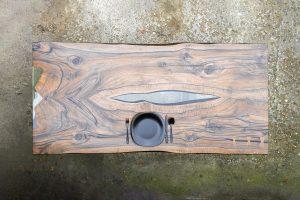 Top view of a beautiful dinning table with black cutlery and a black plate on it