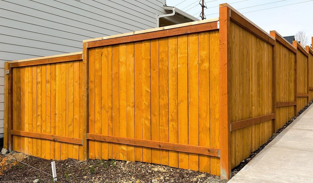 New home backyard wood fence construction