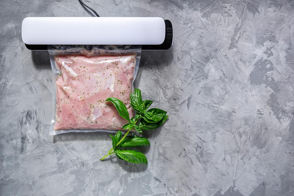 Marinating meat using technology sous vide in a vacuum bag. BBQ meat.