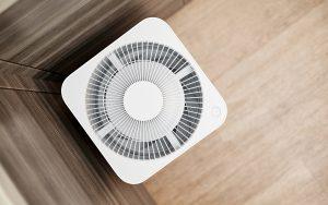 White air purifier in the kitchen of the apartment. Close-up, selective focus. Crawl Space Dehumidifier Buying Guide