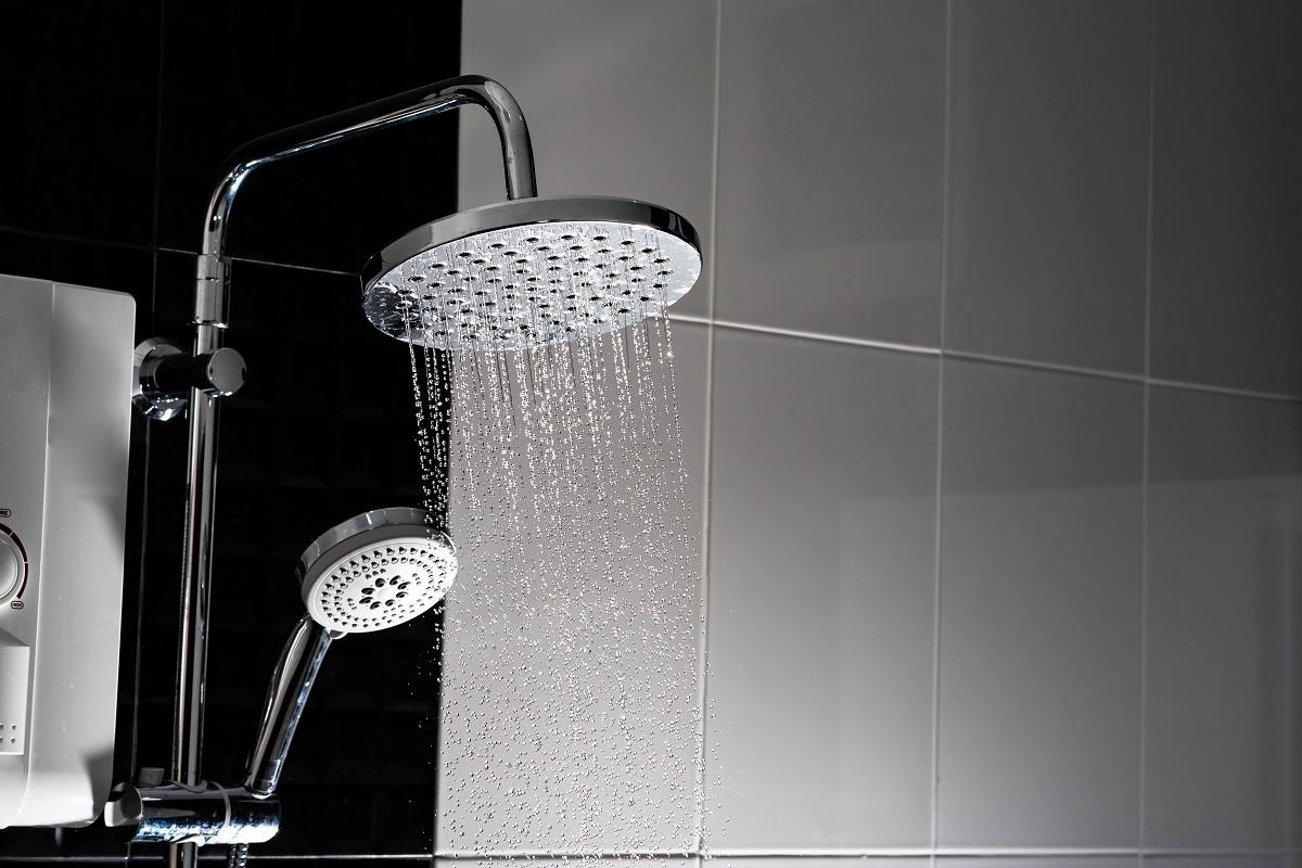 Close up of Water flowing from shower in the bathroom. High Pressure Shower Heads Buying Guide